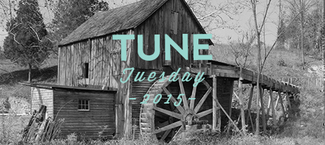 Black and white photo of old wooden mill