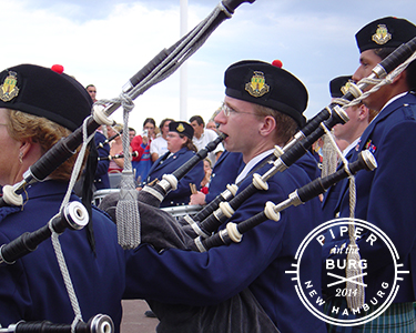 Bagpiper stands at ease